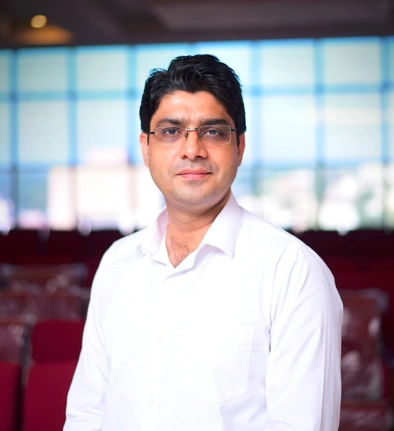 Atif Nazeer, founder of Academy of the Leaders, standing in a conference hall